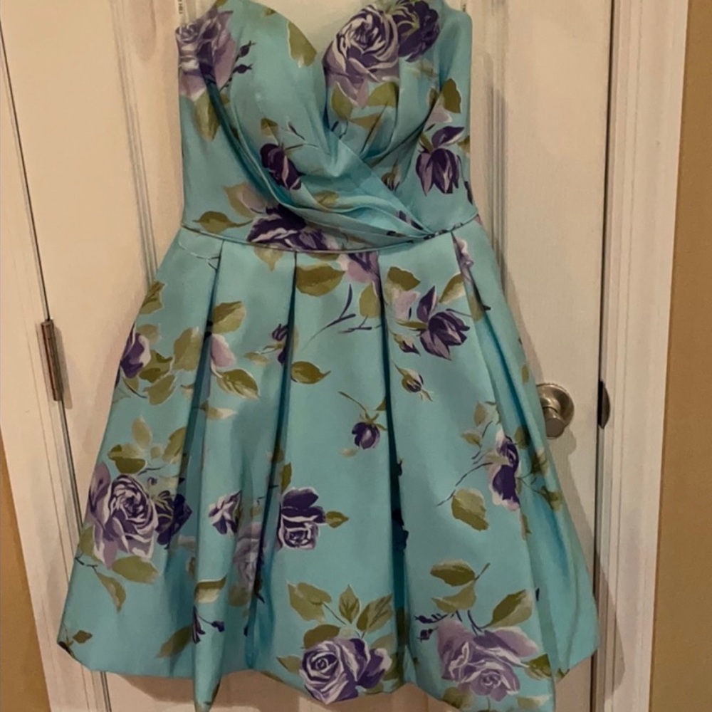 Light blue formal dress with green and purple flowers.